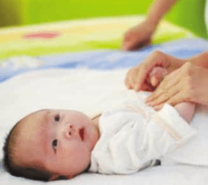 Singapore Confinement Lady Changing Baby Clothes